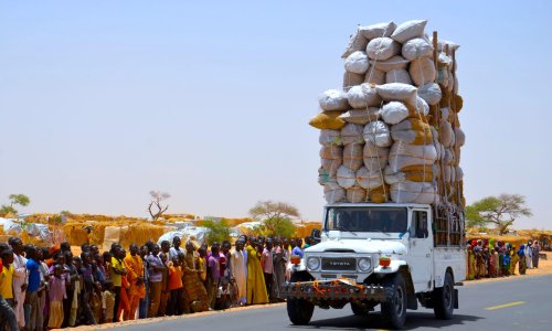  An overloaded truck travels through a refugee camp close to the Niger-Nigeria border in 2016